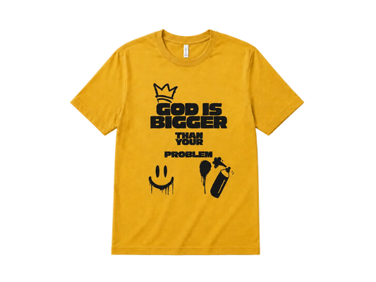 A yellow short-sleeve crewneck t-shirt with a black graphic print on the front. The graphic features a crown above the text 'GOD IS BIGGER THAN YOUR PROBLEM' along with a dripping smiley face and spray paint can illustration.